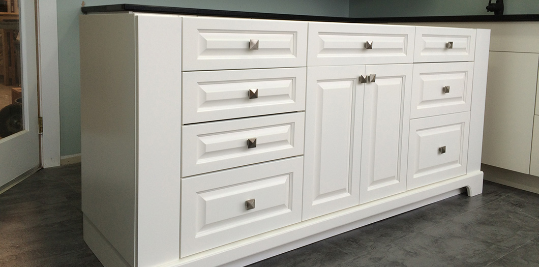 white solid cabinet with silver accessories