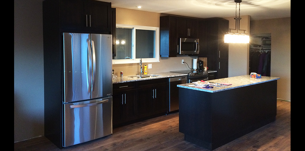 completed dark wood cabinets kitchen