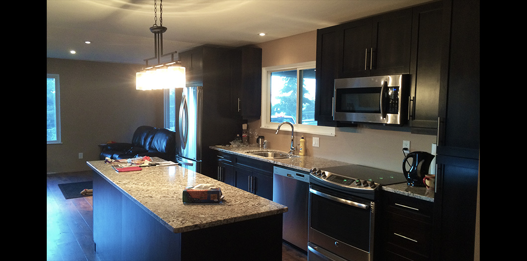 completed dark wood kicthen right side