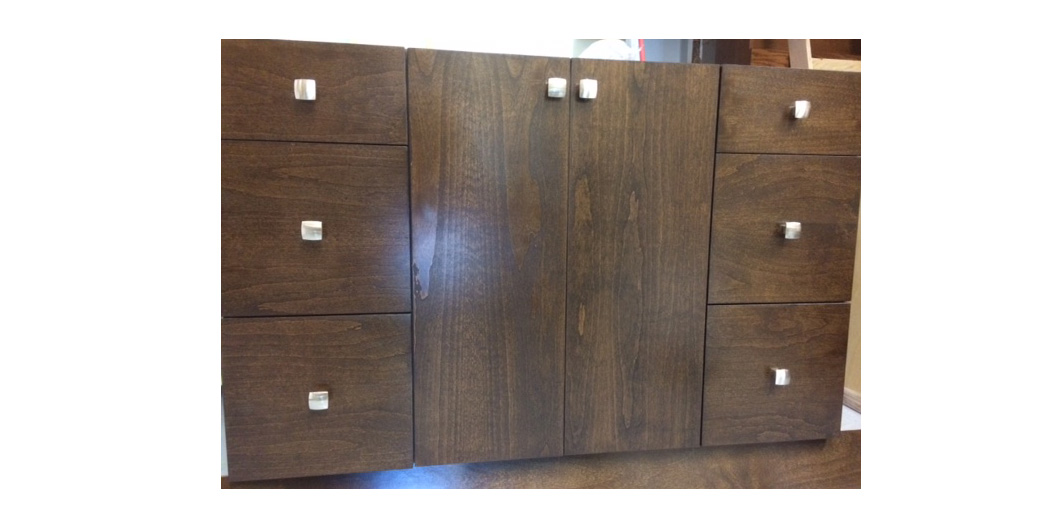 medium wood cabinet with silver accessories